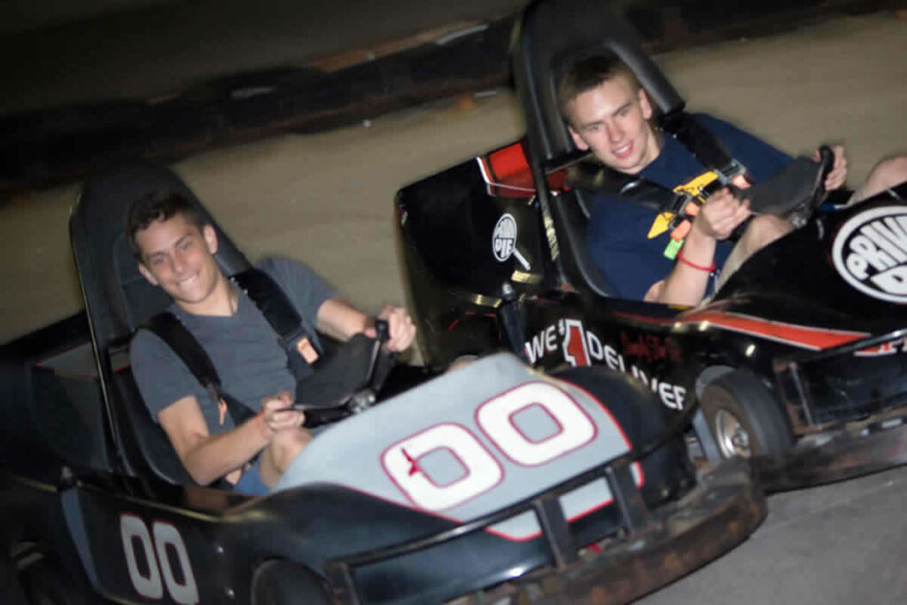 Two boys on go karts school trip
